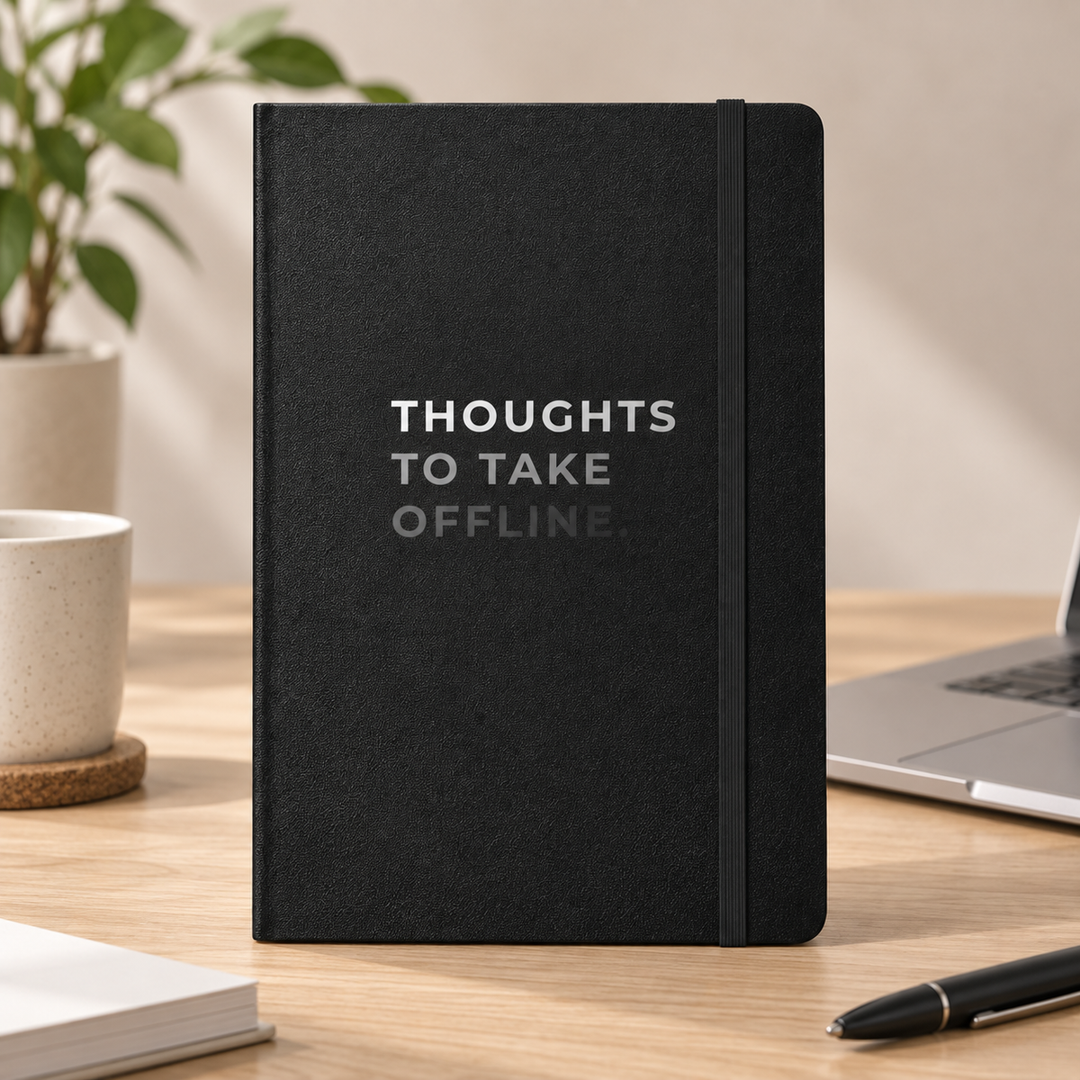 Thoughts to Take Offline Hardcover Notebook — on a desk