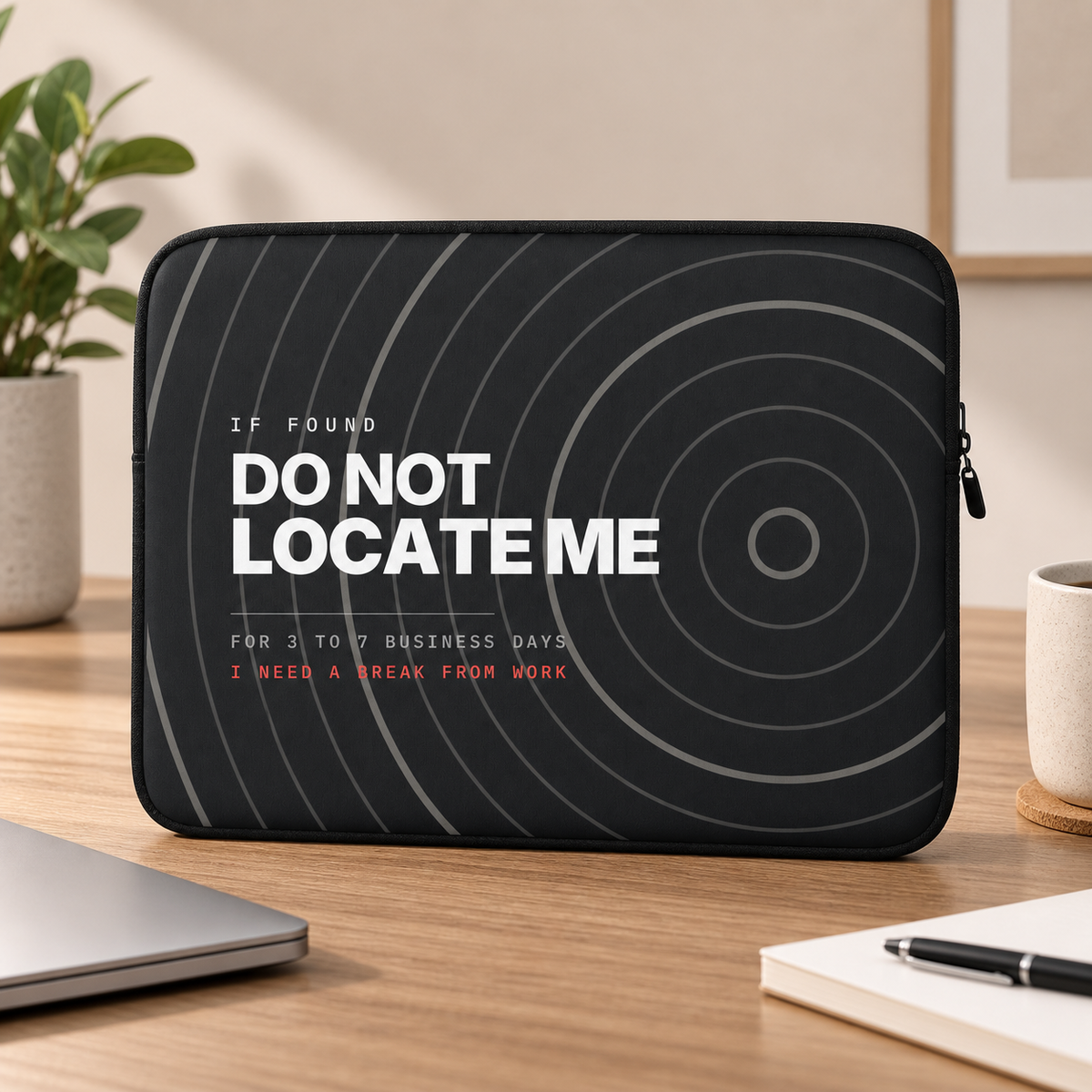Do Not Locate Me Laptop Sleeve — on a desk